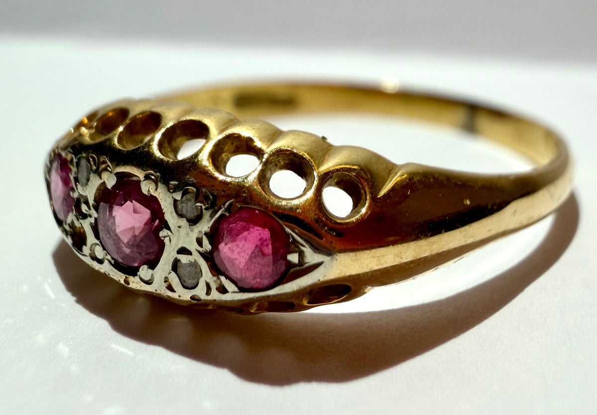 Lot 12: 18ct Ruby Trilogy Yellow Gold Ring