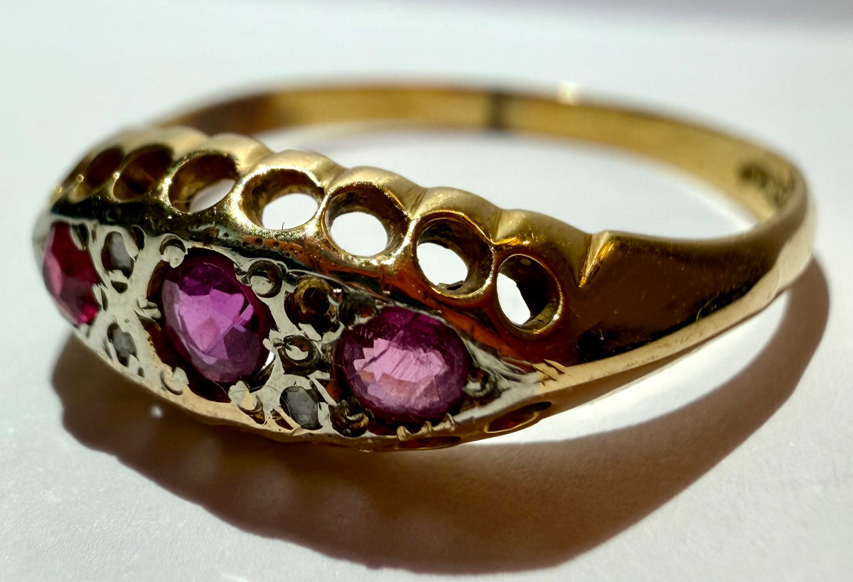 Lot 12: 18ct Ruby Trilogy Yellow Gold Ring